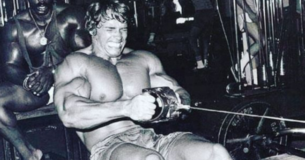 Arnold working out in the gym